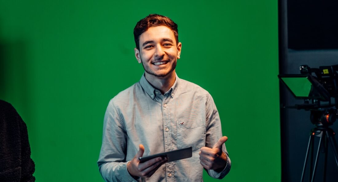 man with a green background