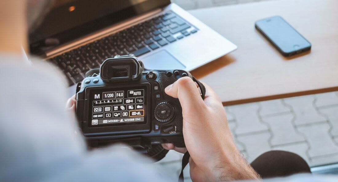 holding a camera