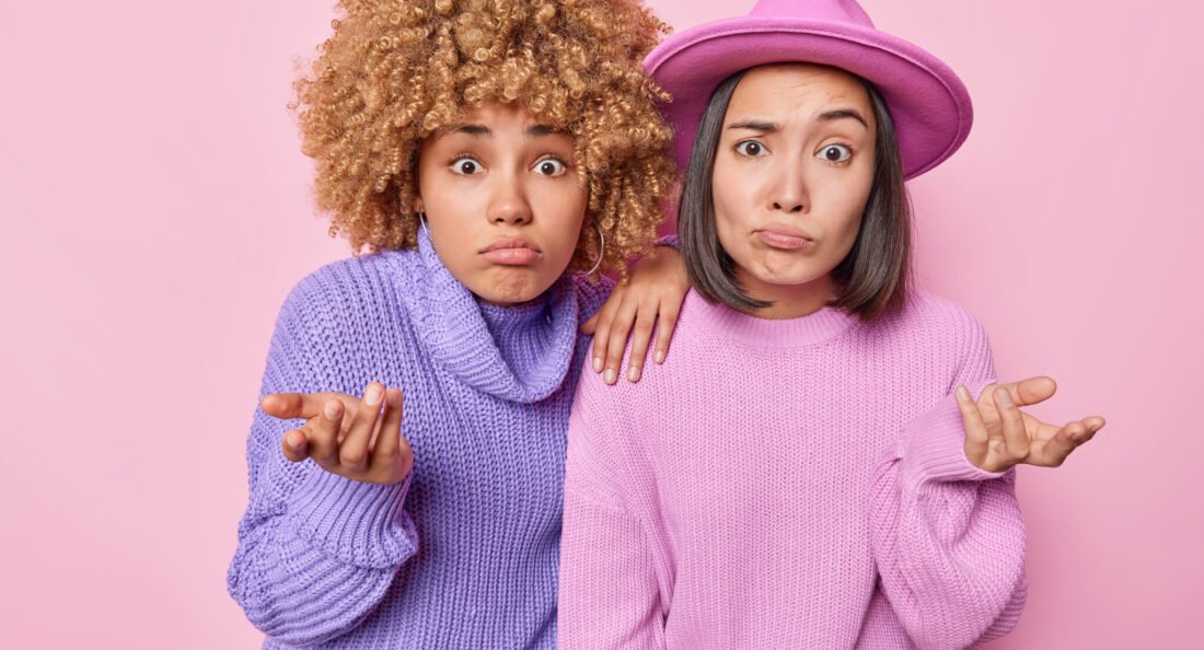 women posing in a photobooth