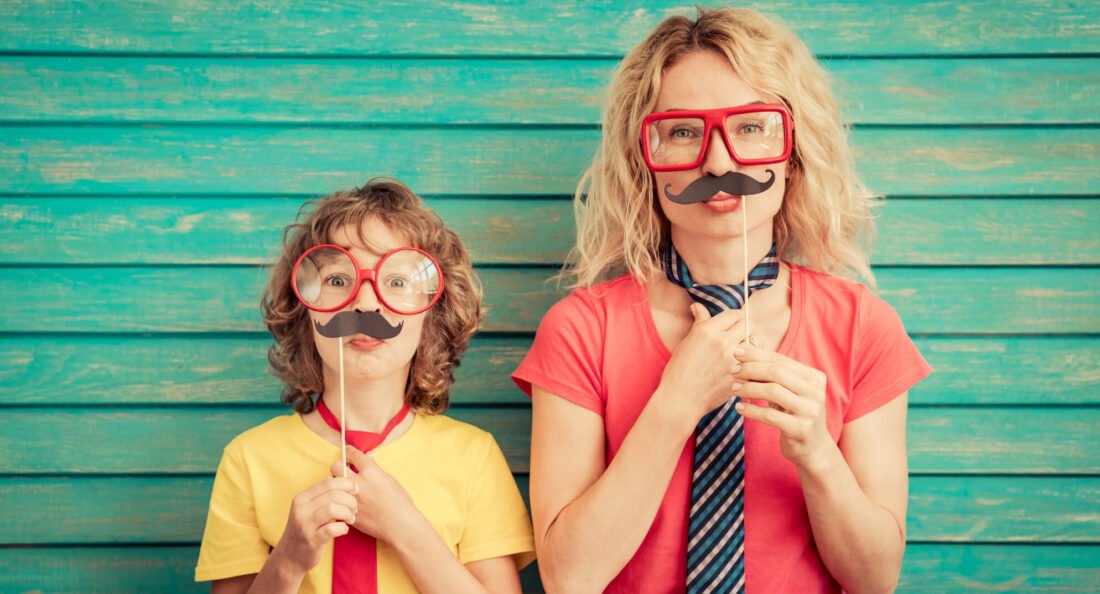woman and kid with fake mustache